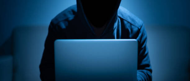 Hacker dark face using laptop in the dark room Top 6 Practices for Robust And Efficient Threat Hunting